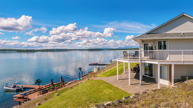 lake house with dock and boat