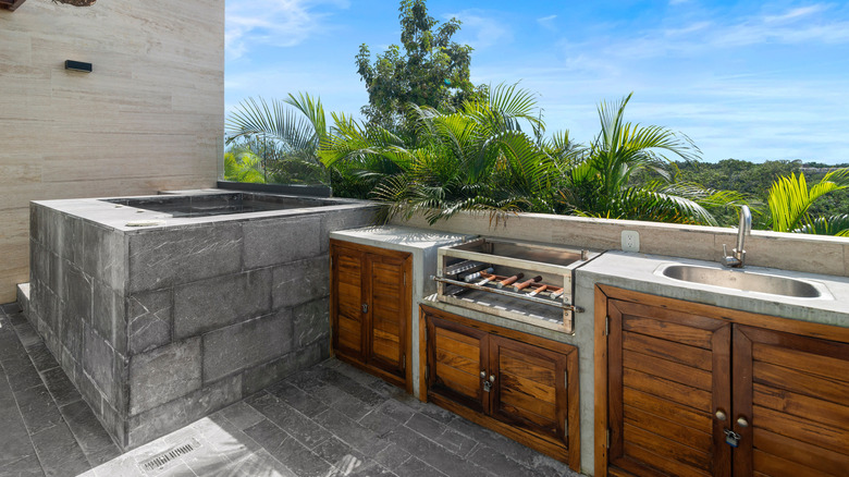 Outdoor kitchen made from stone and wood