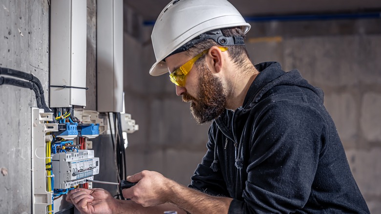 electrician working on panel