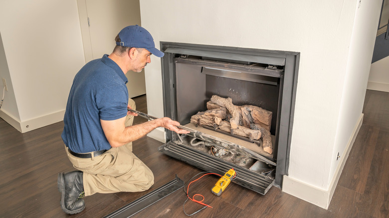 technician installing fireplace