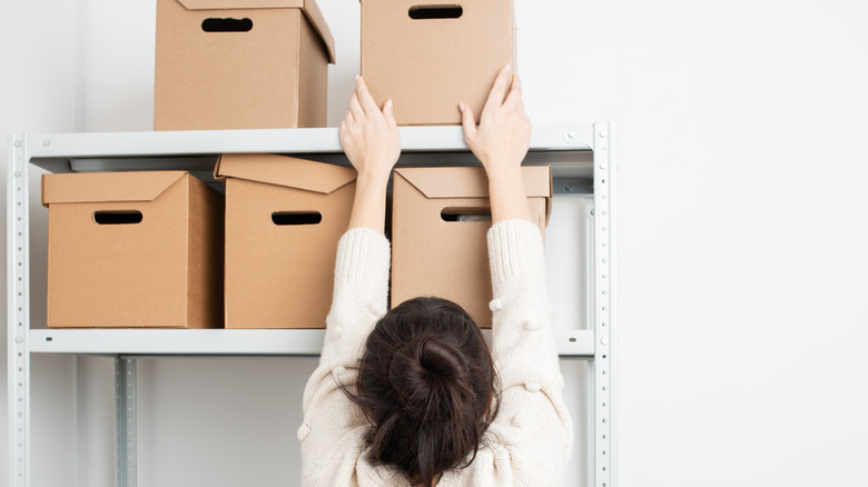 Woman with storage boxes