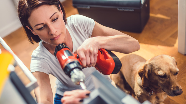 woman using drill power tool