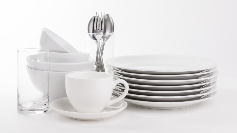 set of white dishes utensils
