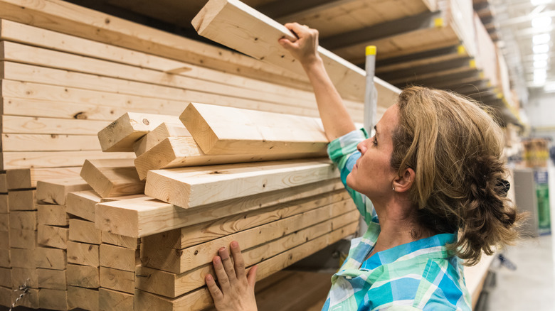 Person shopping for lumber