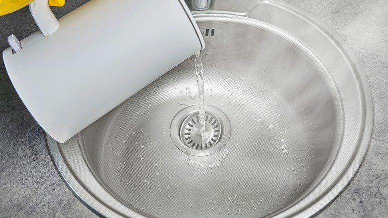 Pouring boiling water down the sink