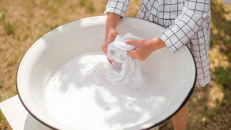 Person hand washing fabrics