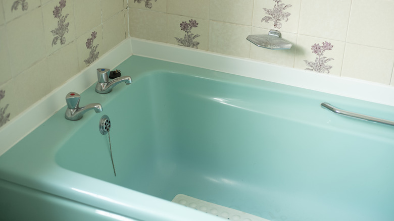 Old turquoise bathtub