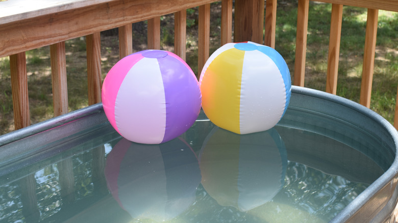 Beach balls in stock tank pool