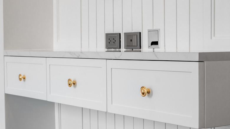 Round cabinet knobs on white cabinets