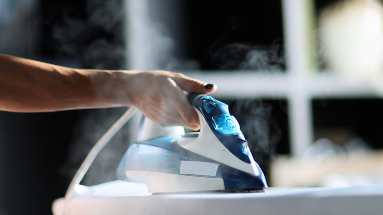 Person using steam iron