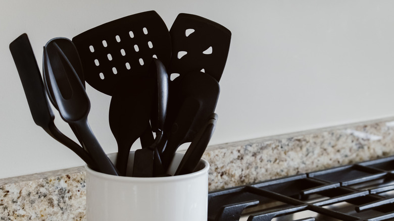 black kitchen utensils on a kitchen counter