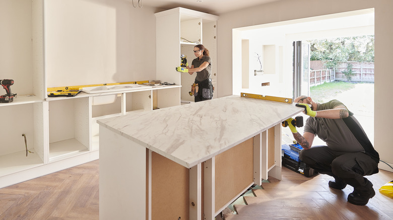 Person installing countertop