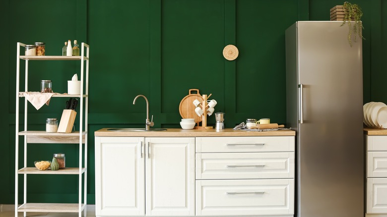 Kitchen with dark green walls