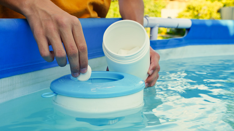 putting chlorine tablet in floater