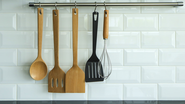 Cooking utensils on steel rack