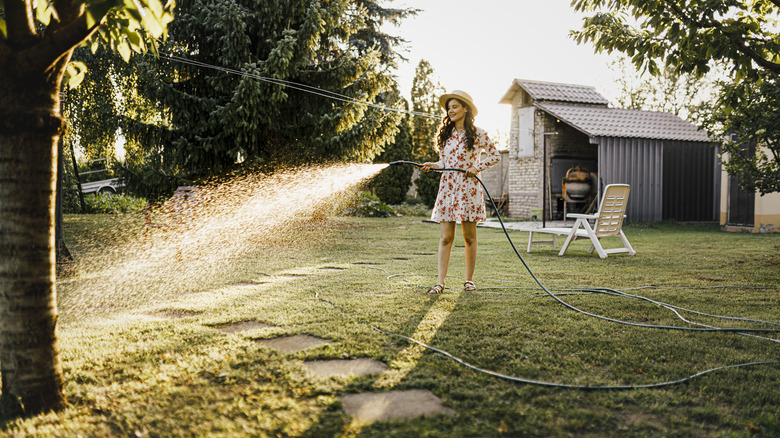 A woman watering plants 