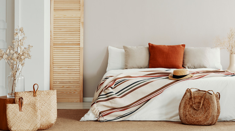 Earthy neutral bedroom with gray wall