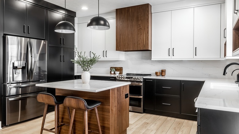 Kitchen with black and white cabinets