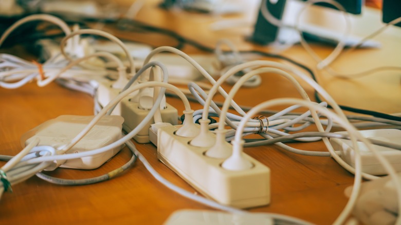 Power strip with tangled charging cords