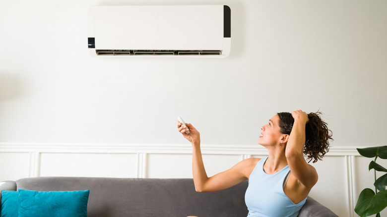 Woman turns on mini split AC