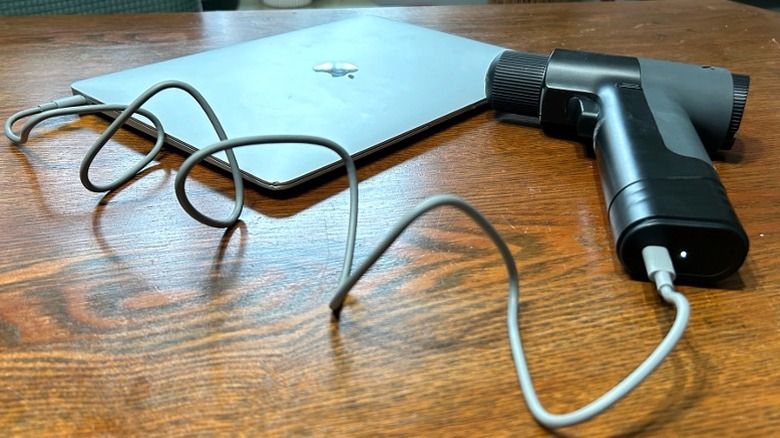 BLACKZERO drill charging laptop on wood table