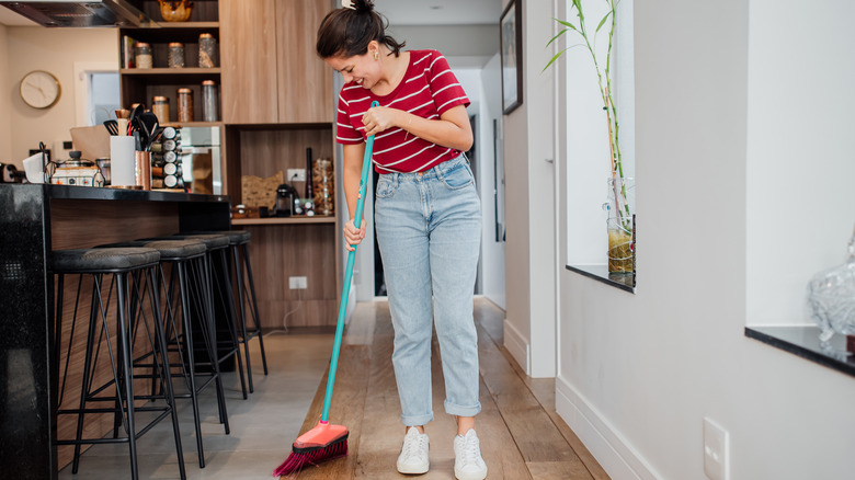 person sweeping