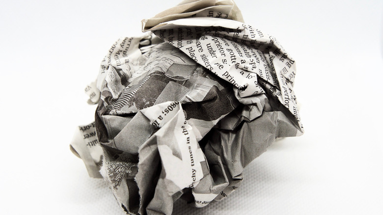 crumpled ball of newspaper 