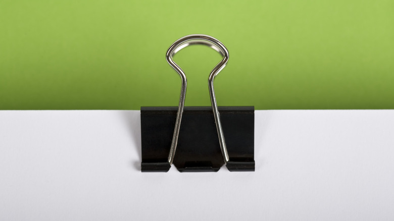 binder clip on white paper