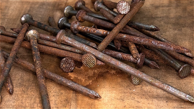 Rusted nails in a container