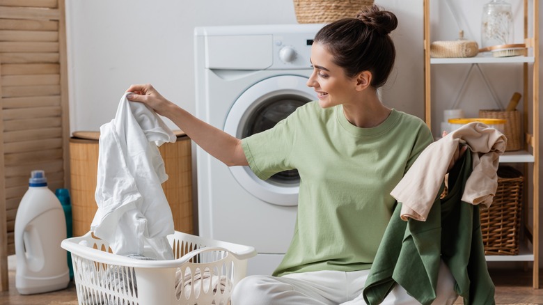 Woman sorting laundry