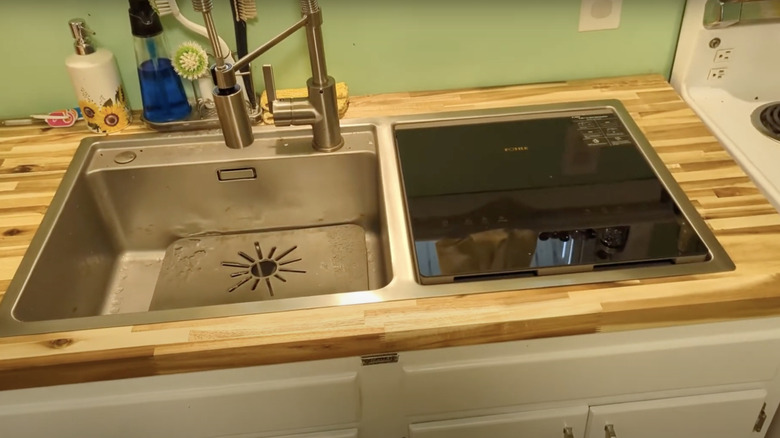 A FOTILE 3-in-1 dishwasher installed in a period authentic 1950s kitchen.