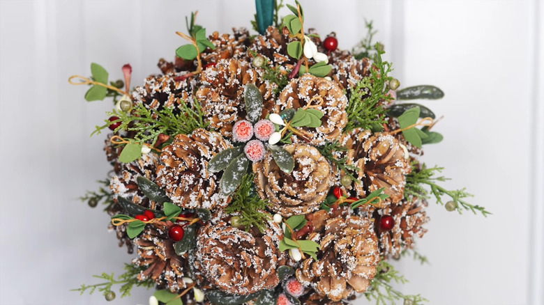 Pine cone ball with ribbon