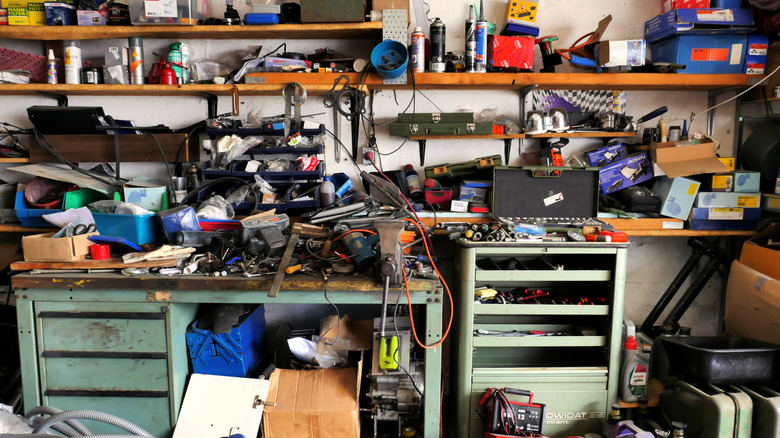 An untidy collection of tools, accessories, and parts