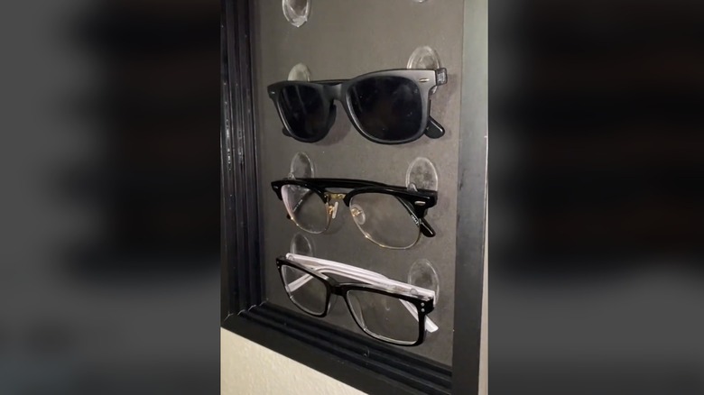 Sunglasses hooked on display box