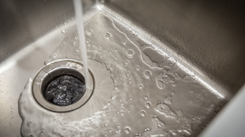 Stainless steel sink with garbage disposal