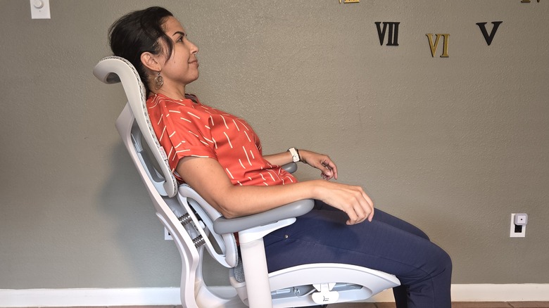 Woman sitting on office chair