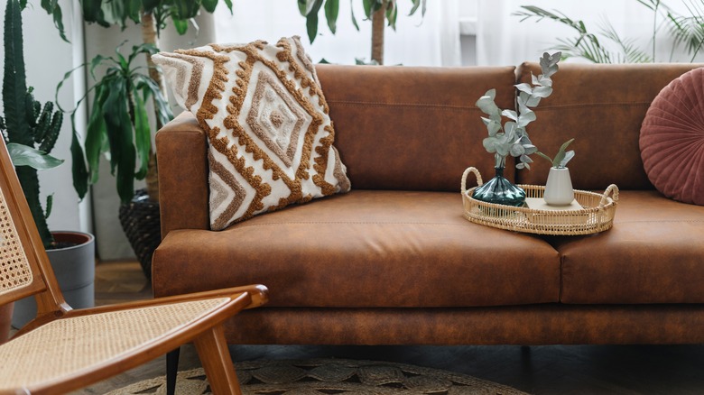 Leather couch in a bohemian living room