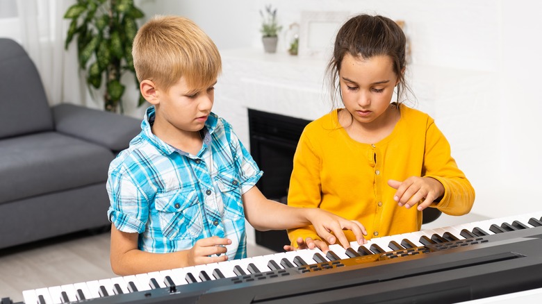 children playing on keyboard