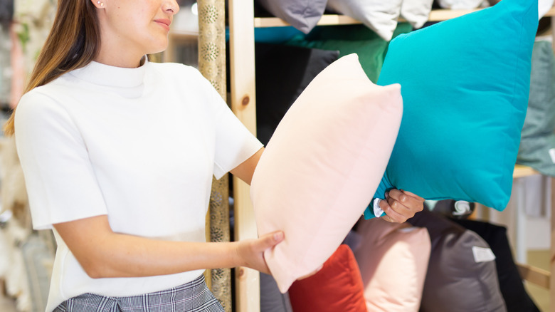 person buying throw pillows