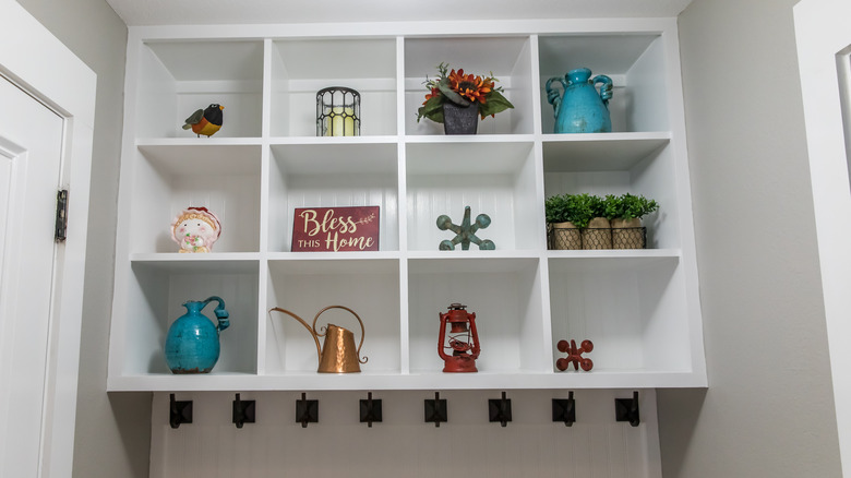 mudroom with items on shelves