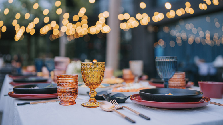 colorful glasses and dishes on table