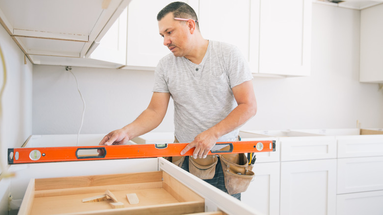 Man installing countertops