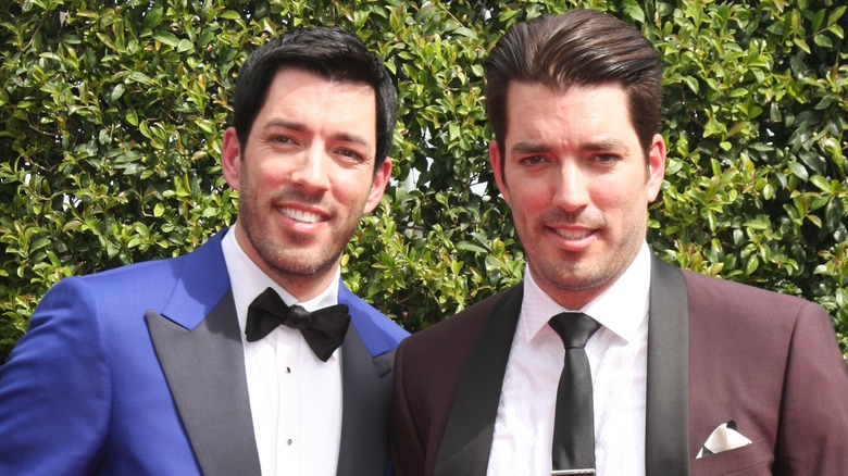Jonathan and Drew Scott wearing suits