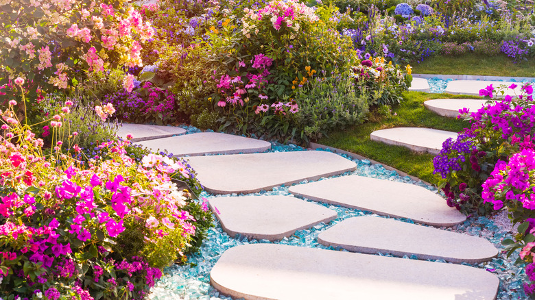 stone pathway around colorful flowers