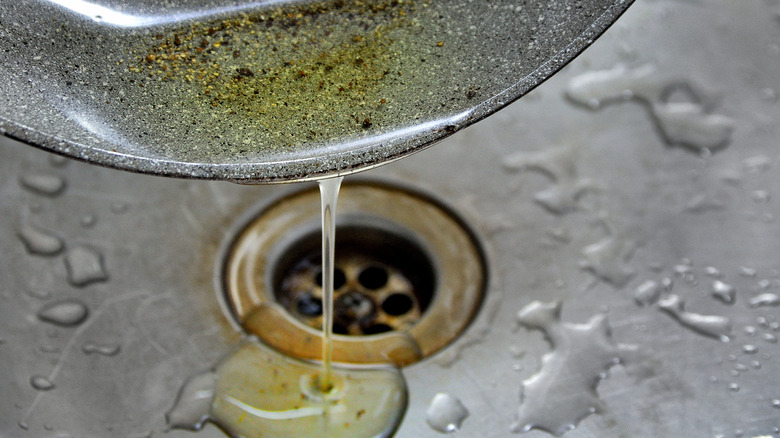 pouring oil into sink