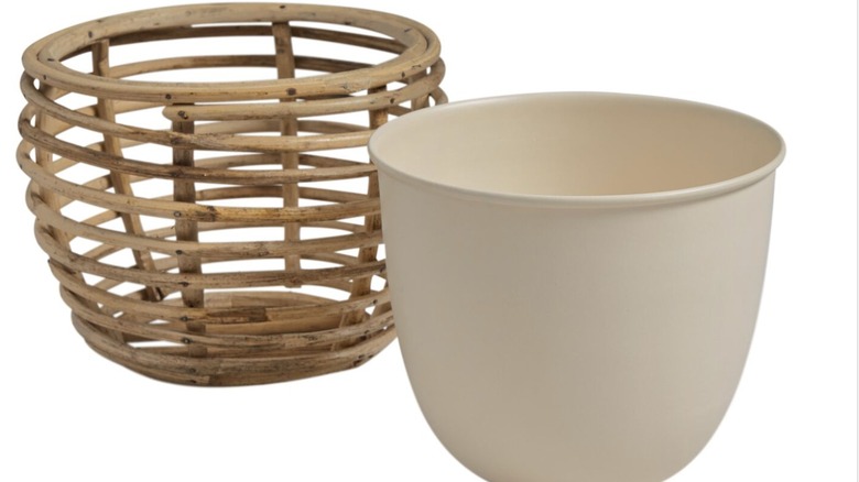 Metal planter with rattan stand