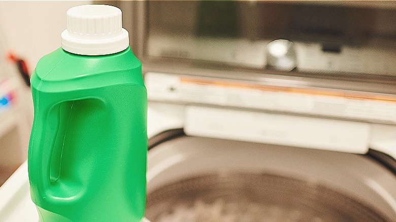 Laundry detergent bottle in foreground