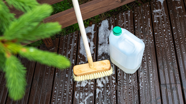 Broom and detergent on deck