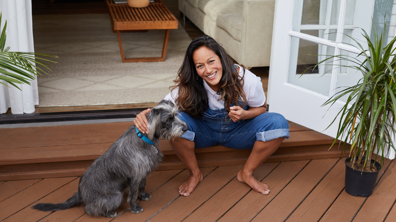 Woman with dog on deck