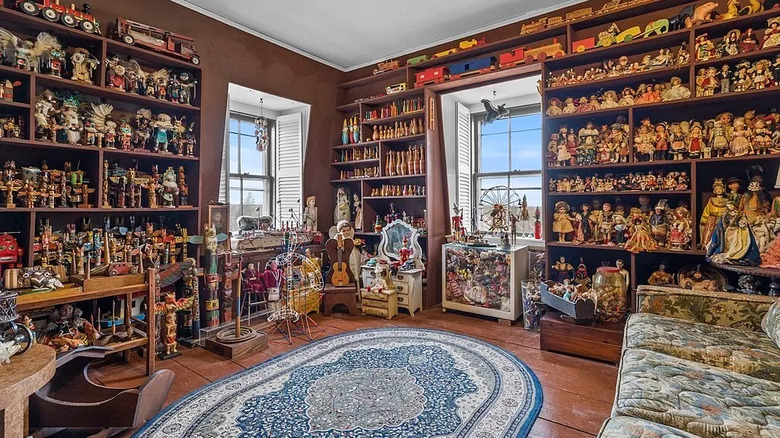 Brown room filled with dolls